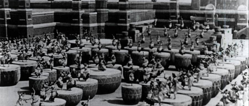 Multiple dancers dancing on small to big size Drums